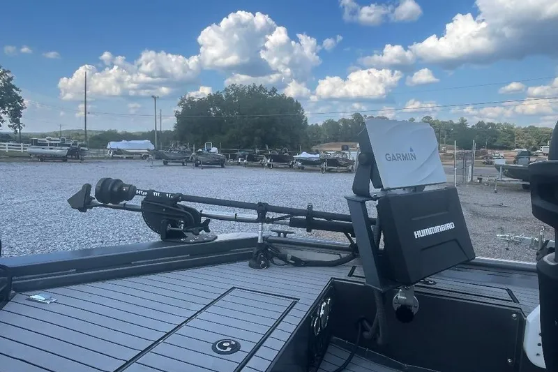 Slide: The Image of 2021 Weld-Craft 1860 PF boat with Garmin and Humminbird equipment, parked outdoors. - 5