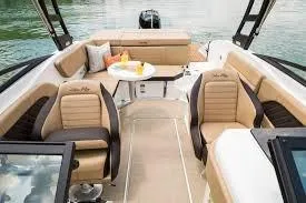 Slide: The Image of 2020 Sea Ray SPX 230 boat interior with beige seating and a small table. - 4