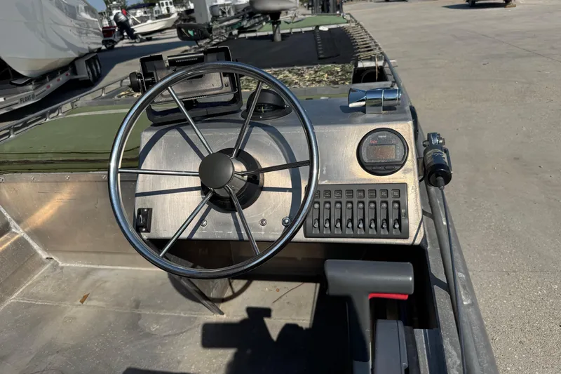 Slide: The Image of Steering console of a 2013 Hanko 19 SC boat with control panel and switches. - 10