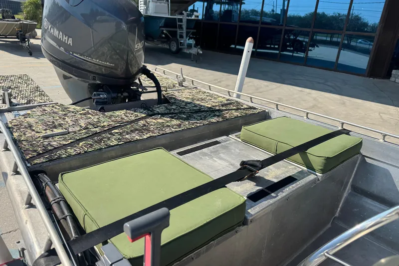 Slide: The Image of Hanko 19 SC 2013 boat with Yamaha engine, green cushions, and camouflage deck. - 15