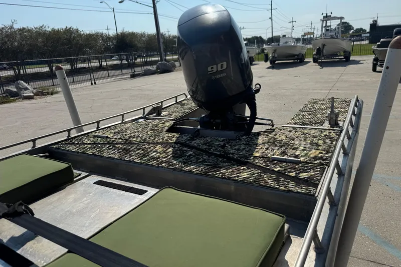 Slide: The Image of 2013 Hanko 19 SC boat with Yamaha 90 engine, camo deck, and green seats. - 16