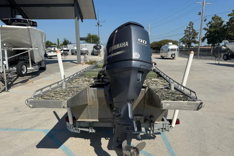 Slide: The Image of 2013 Hanko 19 SC boat with Yamaha 90 outboard motor in a marina. - 9