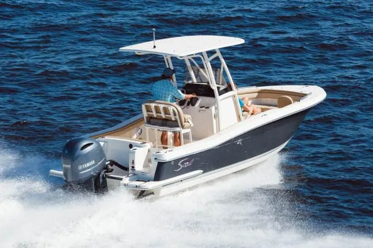 Slide: The Image of Manufacturer Provided Image: 2025 Scout 215 XSF boat cruising on open water. - 14