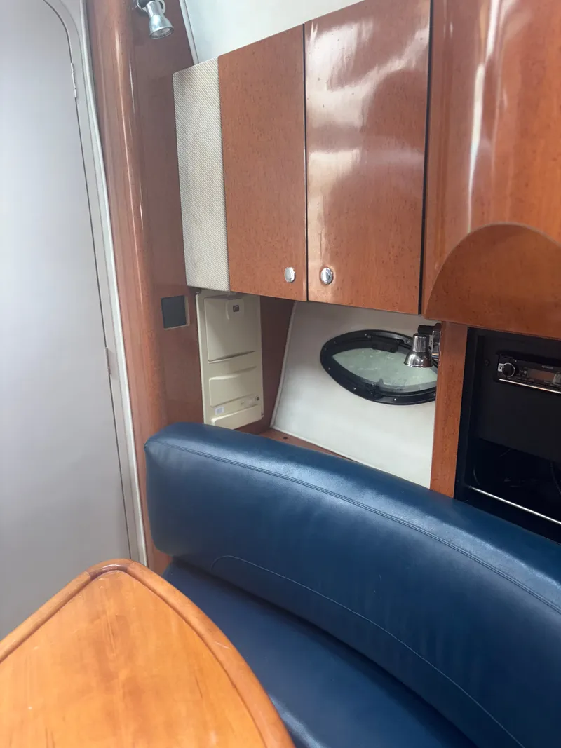Slide: The Image of Interior of a 2001 Doral 330 SE yacht with wooden cabinetry. - 11