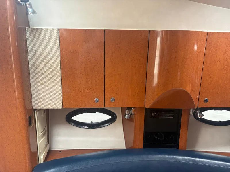 Slide: The Image of Interior of 2001 Doral 330 SE yacht with wooden cabinets. - 13