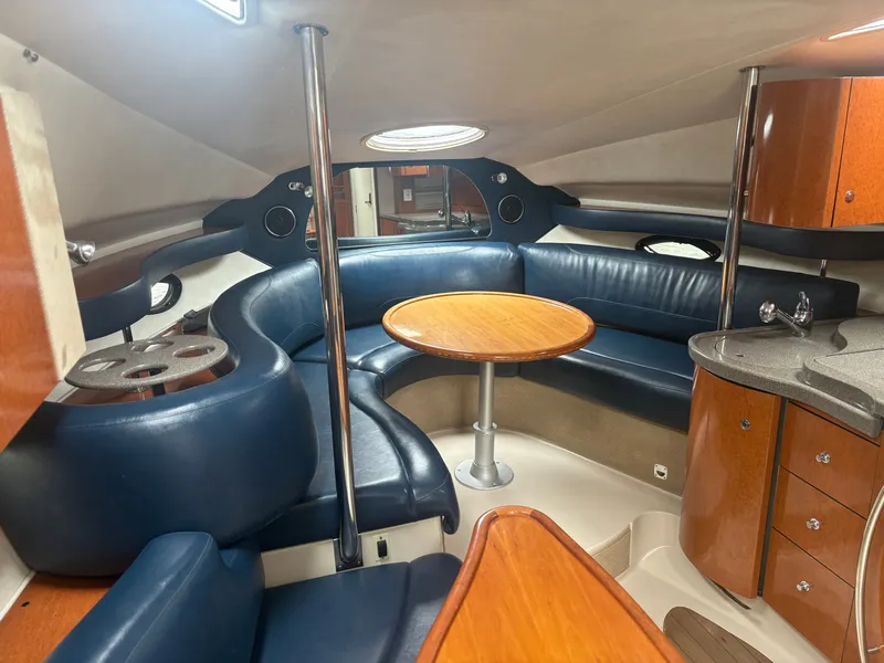 Slide: The Image of Interior of a 2001 Doral 330 SE yacht with blue leather seating. - 17