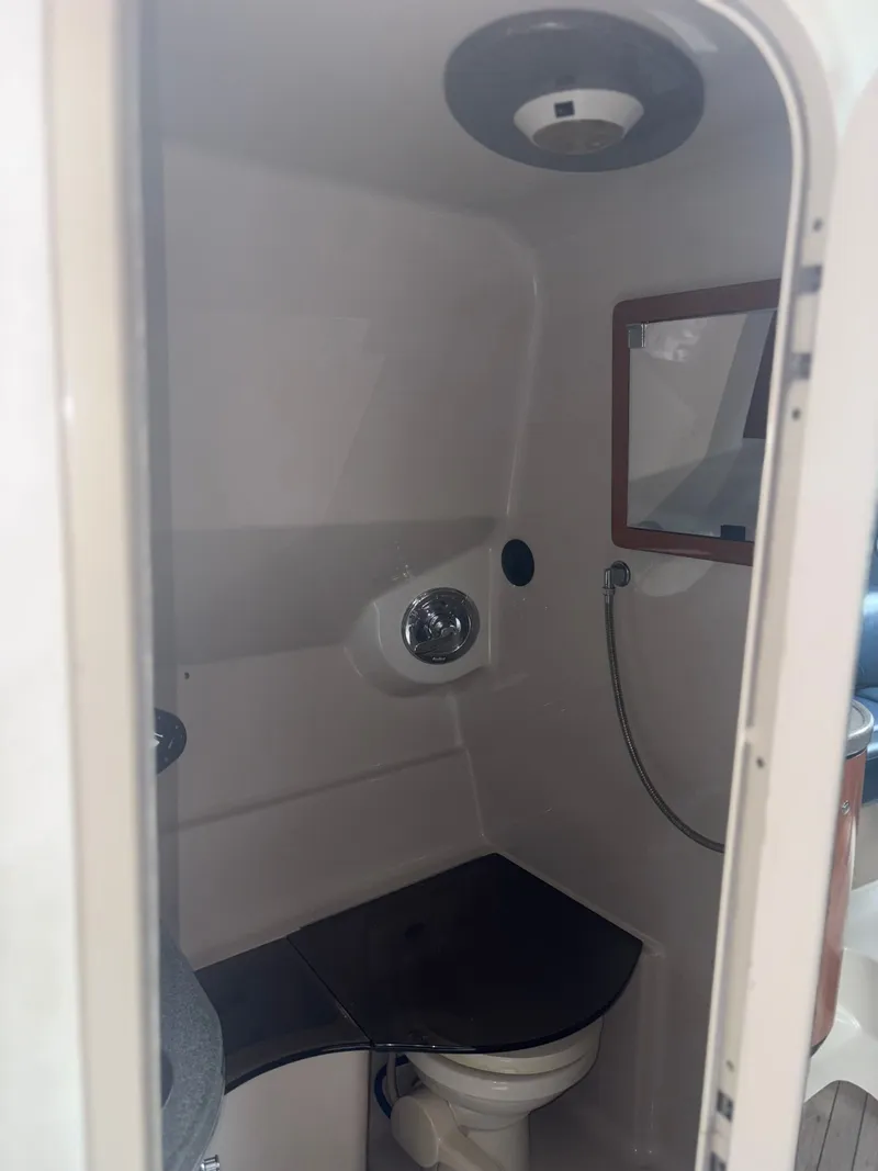 Slide: The Image of Interior of a 2001 Doral 330 SE with toilet and sink. - 22