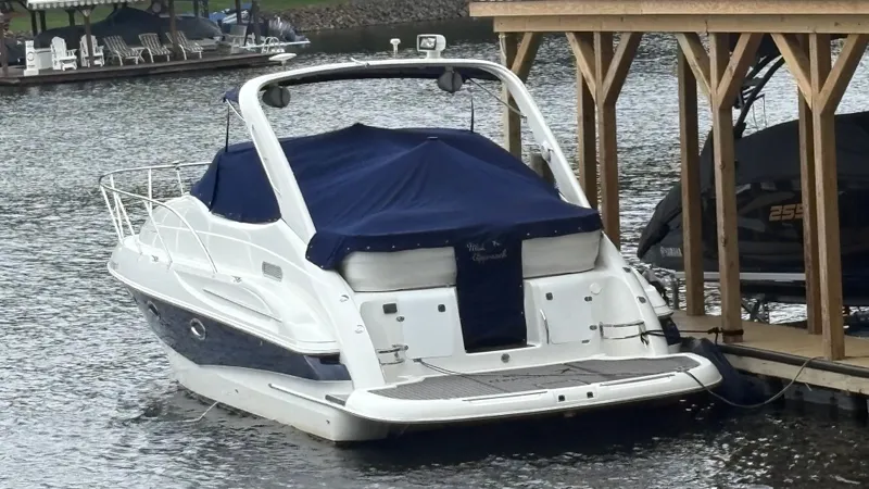 Slide: The Image of Interior of a 2001 Doral 330 SE yacht with white leather seating. - 4