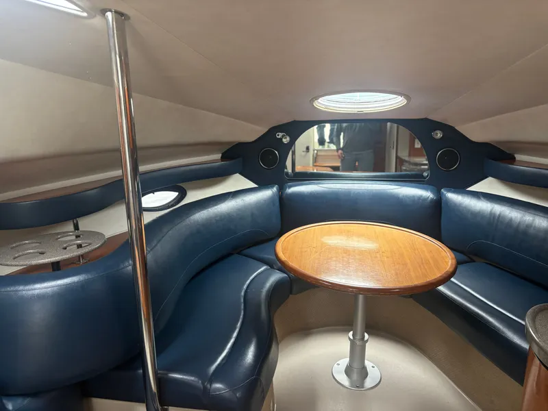 Slide: The Image of Interior of a 2001 Doral 330 SE yacht with white seating. - 5