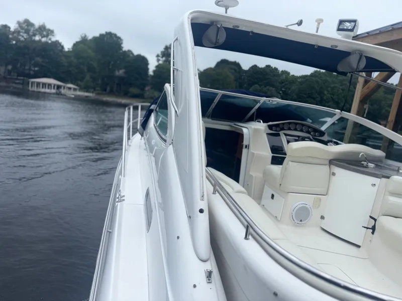 Slide: The Image of Interior of a 2001 Doral 330 SE yacht with white seating. - 7