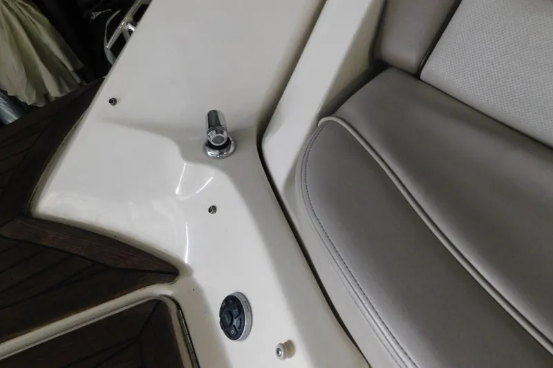 Slide: The Image of Interior detail of a 2012 Sea Ray 300 SLX boat, featuring seating and deck elements. - 13