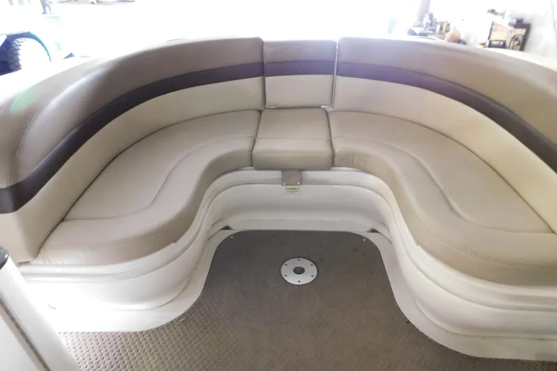 Slide: The Image of 2012 Sea Ray 300 SLX boat interior with curved beige seating. - 15