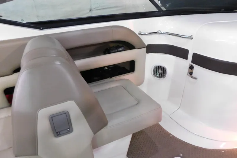 Slide: The Image of Interior of a 2012 Sea Ray 300 SLX boat, featuring seating and storage. - 19