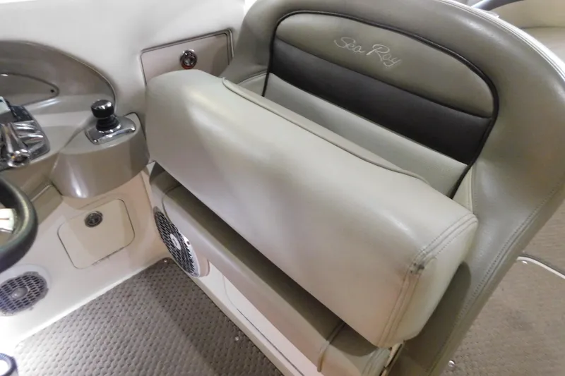 Slide: The Image of 2012 Sea Ray 300 SLX boat interior with beige leather seating and control panel. - 24