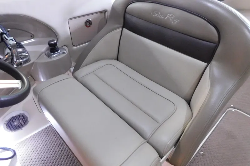 Slide: The Image of 2012 Sea Ray 300 SLX boat interior with beige leather seating and control panel. - 25