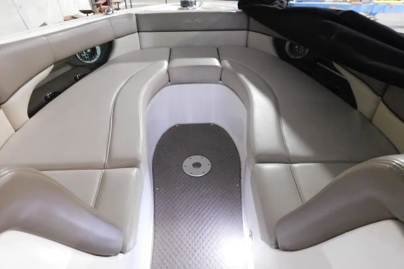 Slide: The Image of Interior of 2012 Sea Ray 300 SLX boat with cushioned seating and sleek design. - 28