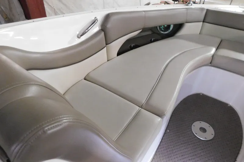 Slide: The Image of Luxurious seating area on a 2012 Sea Ray 300 SLX boat, featuring beige upholstery. - 29