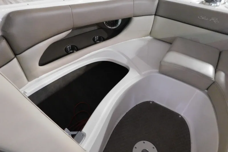 Slide: The Image of Interior seating area of a 2012 Sea Ray 300 SLX boat with storage compartment. - 32