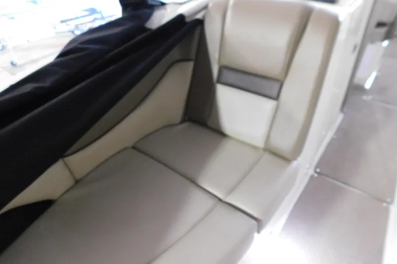 Slide: The Image of Interior seating of 2012 Sea Ray 300 SLX boat, featuring beige upholstery. - 34
