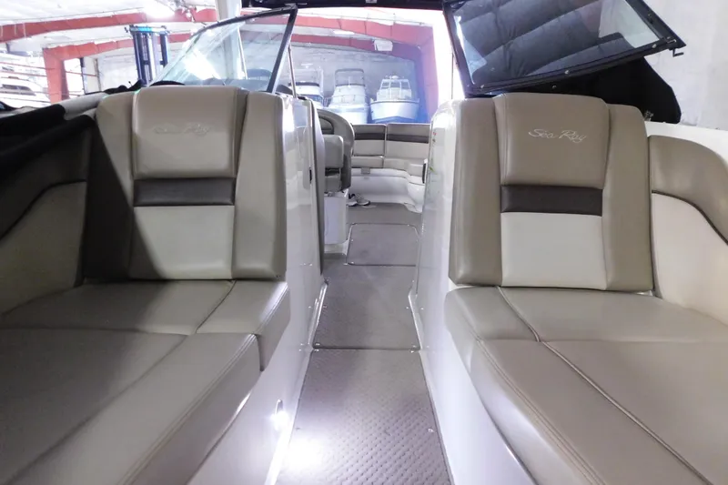 Slide: The Image of Interior view of a 2012 Sea Ray 300 SLX boat with beige seating. - 35