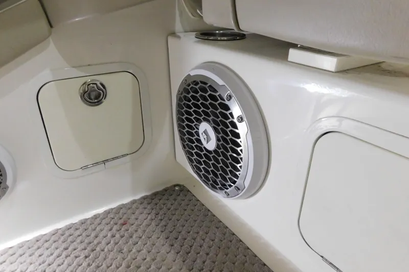 Slide: The Image of 2012 Sea Ray 300 SLX interior with speaker and storage compartment. - 37