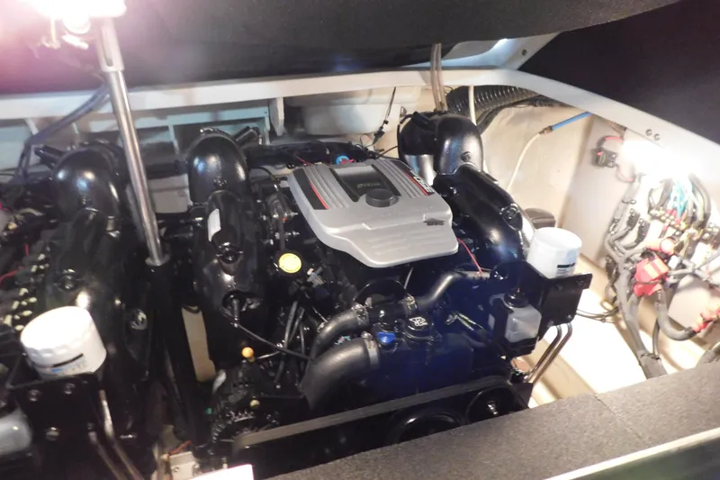 Slide: The Image of Engine compartment of a 2012 Sea Ray 300 SLX boat, showcasing detailed machinery. - 43