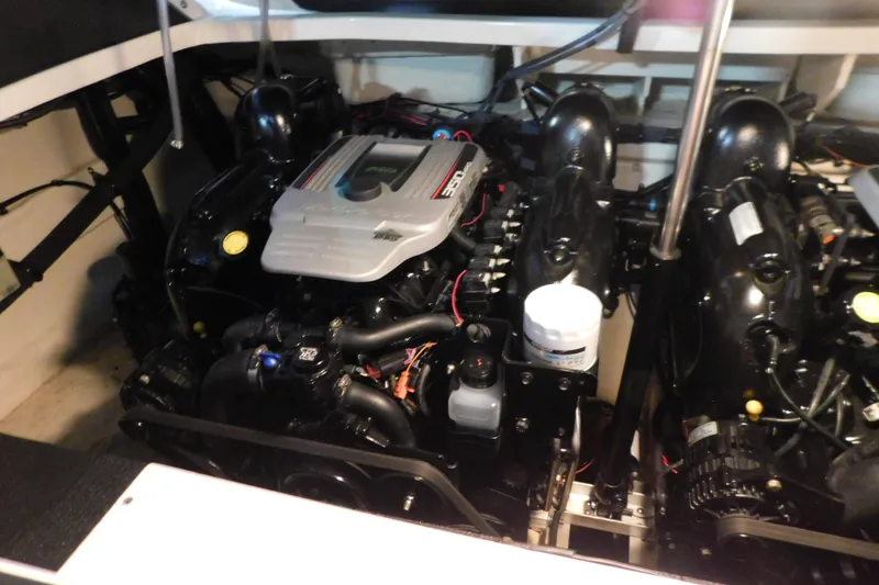 Slide: The Image of Engine compartment of a 2012 Sea Ray 300 SLX boat, showcasing dual engines. - 45