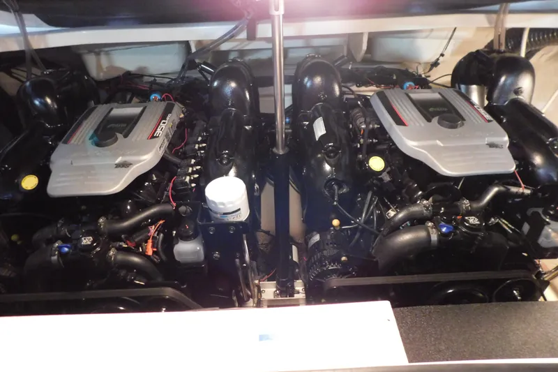 Slide: The Image of Twin engines of a 2012 Sea Ray 300 SLX boat, showcasing powerful performance. - 46