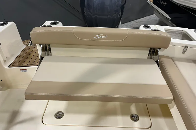 Slide: The Image of 2025 Scout 215 Dorado boat seat with beige upholstery and foldable design. - 13