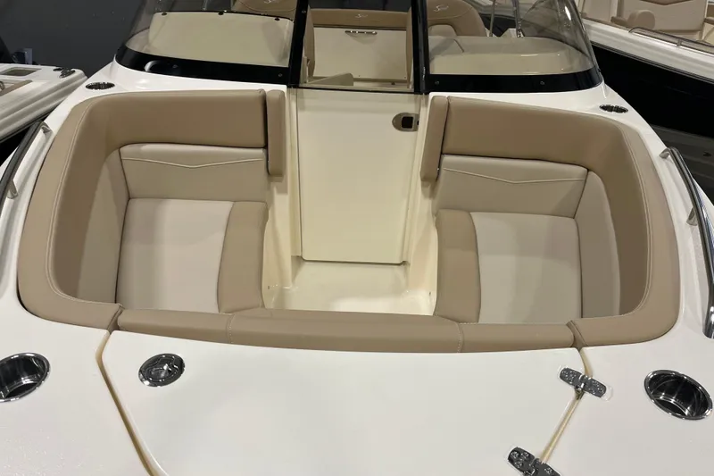 Slide: The Image of 2025 Scout 215 Dorado boat interior with beige seating and sleek design. - 2