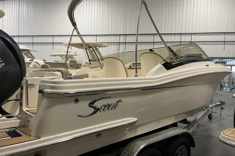 Slide: The Image of 2025 Scout 215 Dorado boat on trailer in indoor showroom. - 4