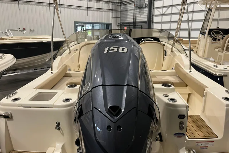 Slide: The Image of 2025 Scout 215 Dorado boat with powerful 150 engine in showroom. - 6