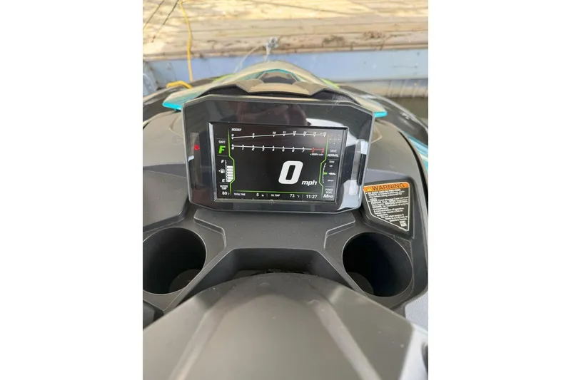 Slide: The Image of 2023 Kawasaki Jetski Ultra 310X dashboard displaying speedometer and controls. - 4