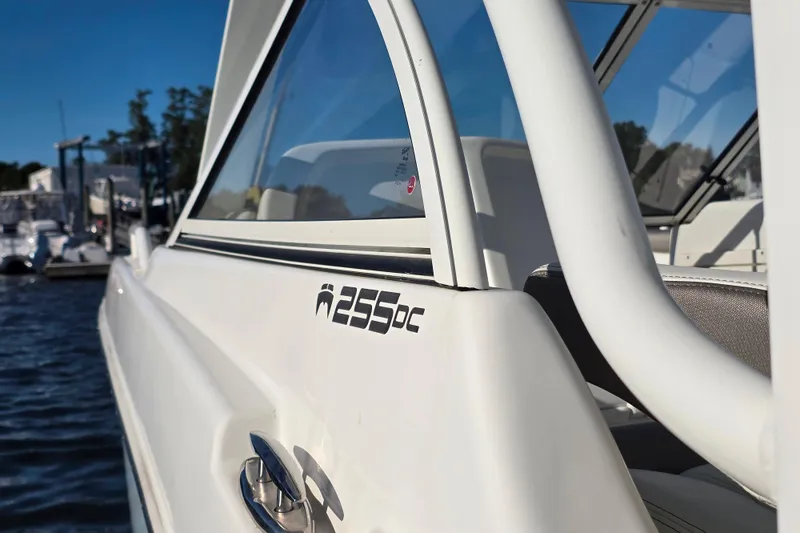 Slide: The Image of 2022 World Cat 255 DC boat close-up, showcasing sleek design and logo. - 11