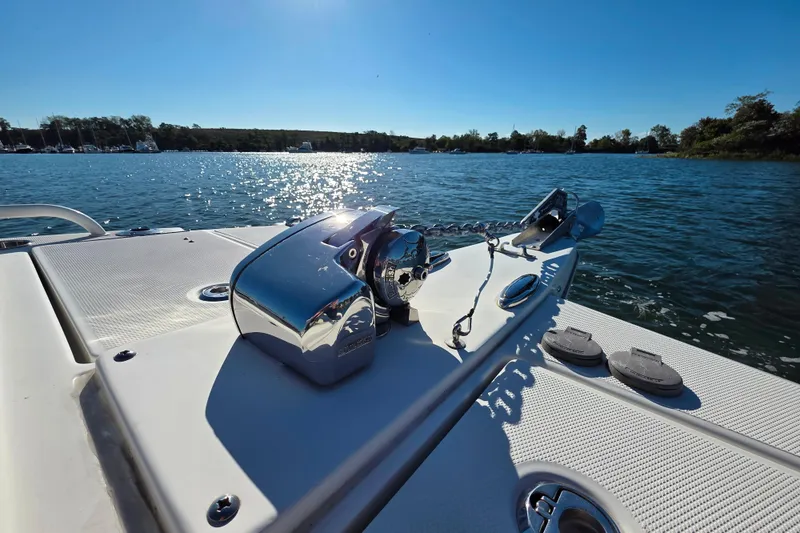 Slide: The Image of 2022 World Cat 255 DC boat with anchor system on a sunny day. - 19