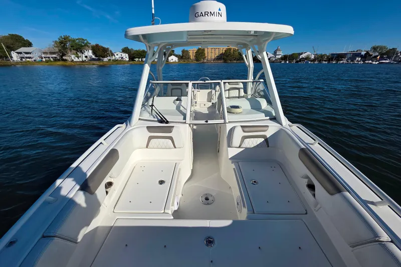 Slide: The Image of 2022 World Cat 255 DC boat on water, featuring spacious seating and Garmin equipment. - 20