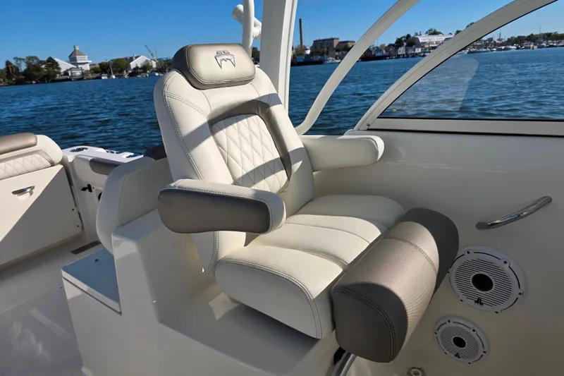 Slide: The Image of Luxury seating on 2022 World Cat 255 DC boat, with scenic water view. - 9