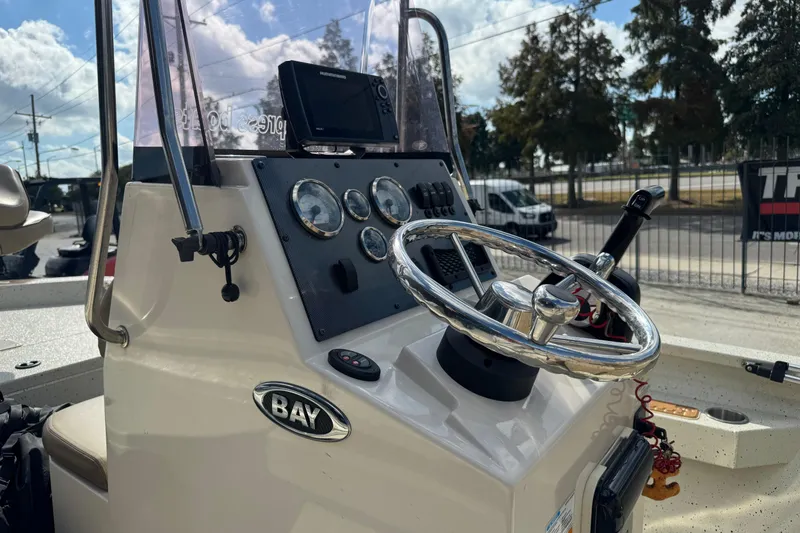 Slide: The Image of 2020 Xpress H20B Bay boat dashboard with steering wheel and gauges. - 12