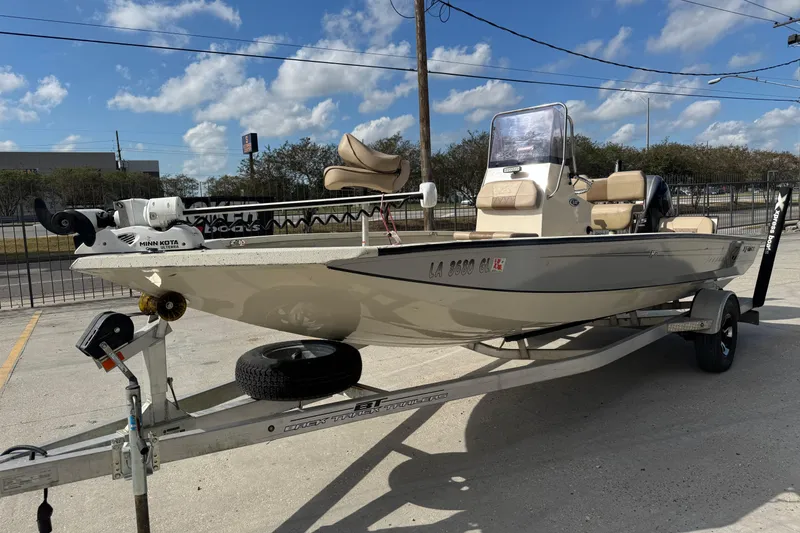 Slide: The Image of 2020 Xpress H20B Bay boat on trailer, featuring Minn Kota trolling motor. - 7