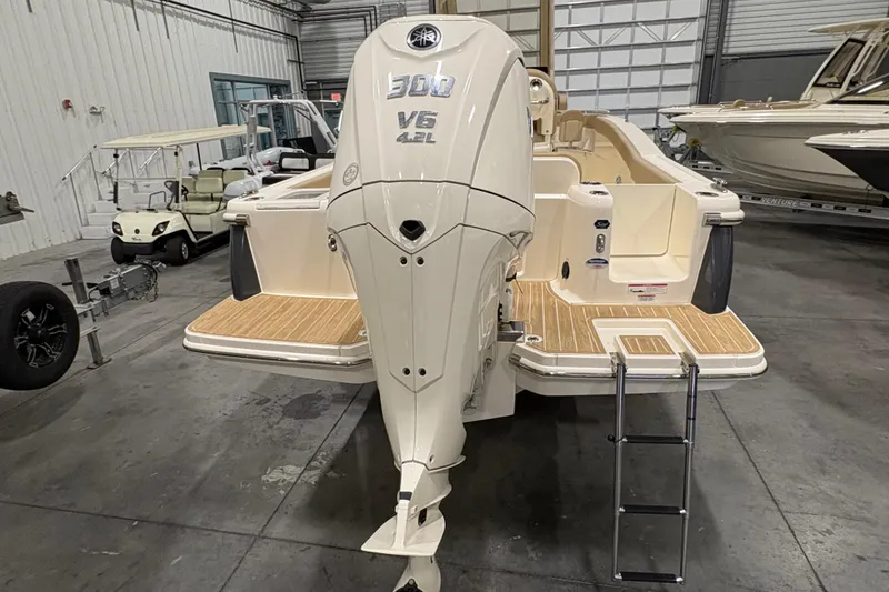 Slide: The Image of 2025 Scout 240 XSF boat with Yamaha 300 V6 engine in a showroom. - 3