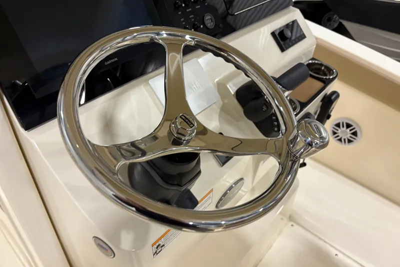 Slide: The Image of Steering wheel of 2025 Scout 240 XSF boat, featuring modern controls and sleek design. - 9