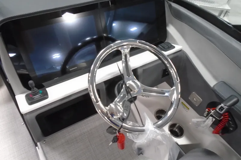 Slide: The Image of 2026 Regal LX4 boat dashboard with steering wheel and modern controls. - 15