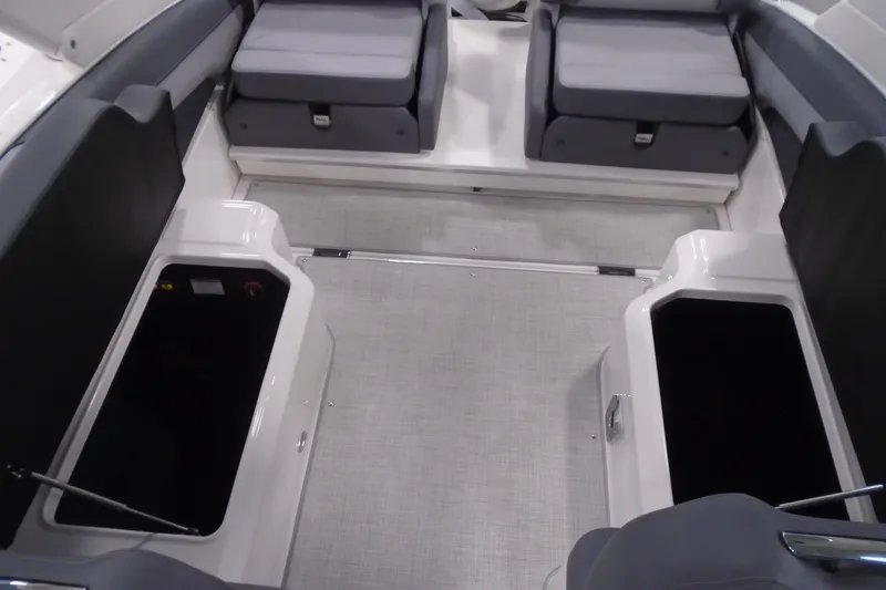 Slide: The Image of 2026 Regal LX4 boat interior with spacious seating and storage compartments. - 20