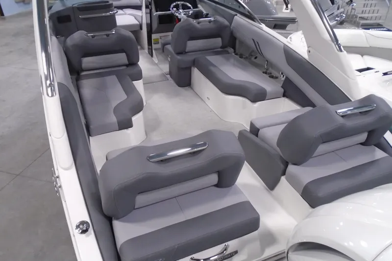 Slide: The Image of 2026 Regal LX4 boat interior with gray seating and modern design. - 7