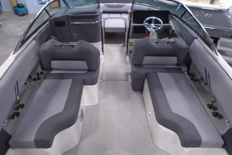 Slide: The Image of 2026 Regal LX4 boat interior with gray seating and modern steering wheel. - 9