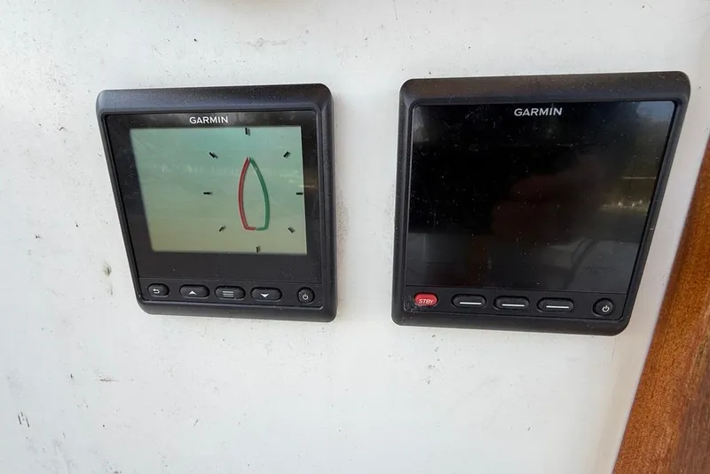 Slide: The Image of Garmin navigation displays on 1986 Tartan 37' sailboat, showing sailing instruments. - 13
