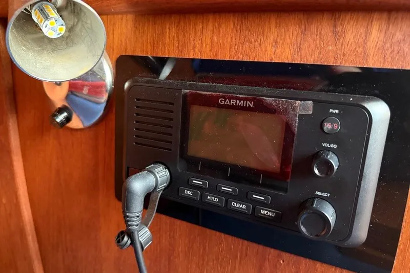 Slide: The Image of Garmin marine radio on 1986 Tartan 37' sailboat, mounted on wooden panel. - 19