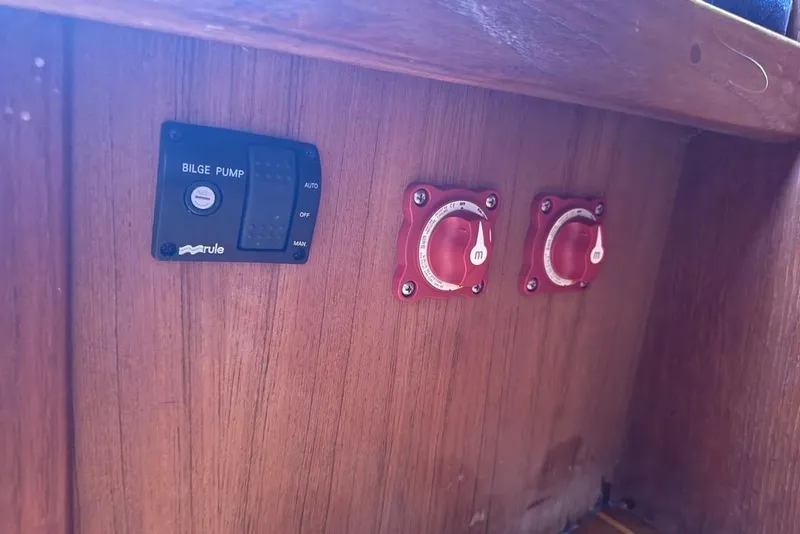 Slide: The Image of Control panel of a 1986 Tartan 37' sailboat with bilge pump and switches. - 25