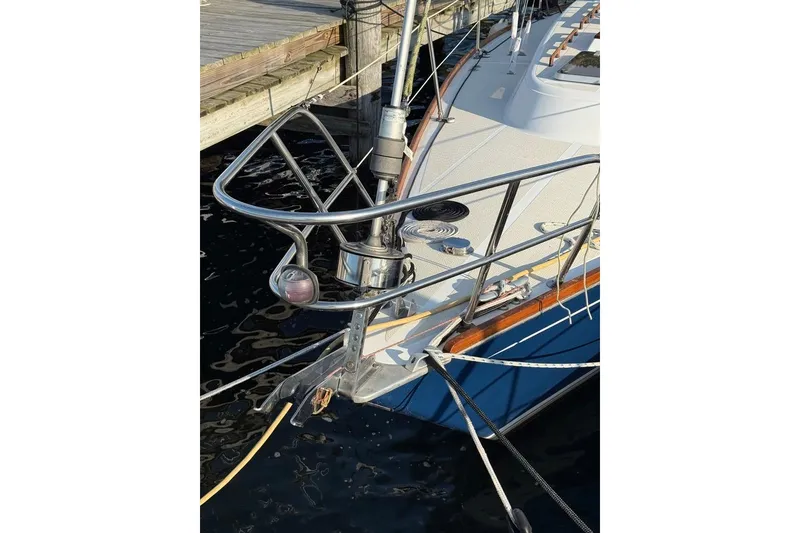 Slide: The Image of 1986 Tartan 37' sailboat bow with stainless steel railings at dock. - 4