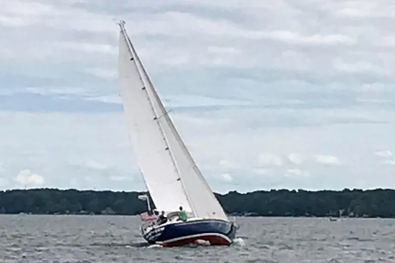 Slide: The Image of Sailboat on water, Tartan 37', 1986 model, sailing under cloudy sky. - 8